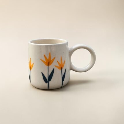 Yellow floral ceramic tea and coffee mug with round handle