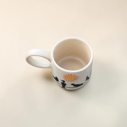 Aesthetic ceramic coffee mug with hand-painted birds and sun artwork
