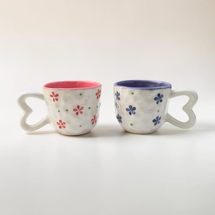 Handpainted pink floral ceramic cups with heart-shaped handles
