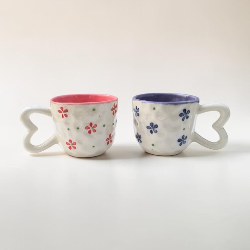 Handpainted pink floral ceramic cups with heart-shaped handles