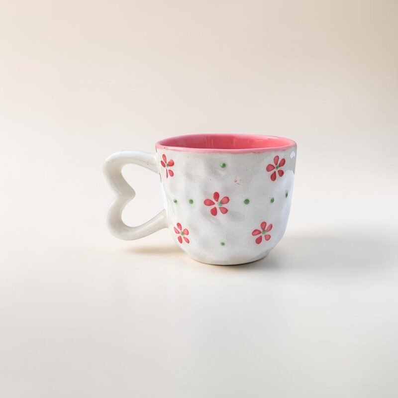 Hand-painted floral ceramic cups with heart handles in pink and lavender