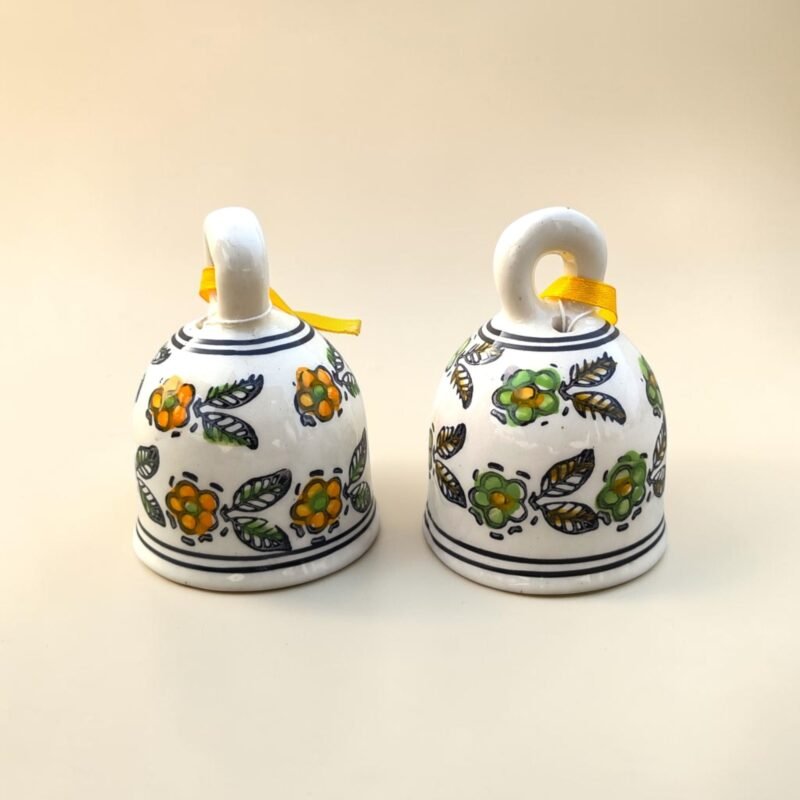 Decorative ceramic hanging bells with yellow and green floral painting