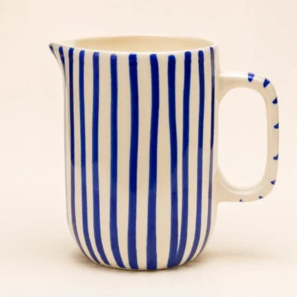 Blue striped ceramic mini jug with handpainted vertical stripes and pouring spout
