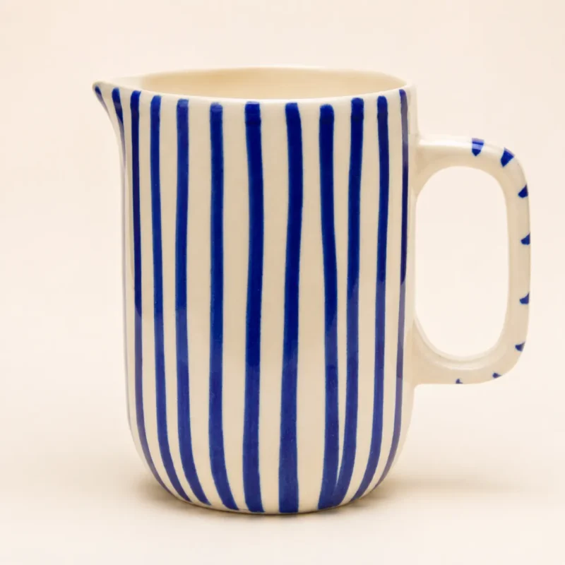Blue striped ceramic mini jug with handpainted vertical stripes and pouring spout