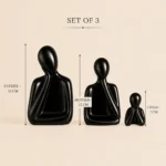 Set of three black ceramic family figures representing father mother and child