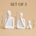 Set of three white ceramic family figures representing father, mother and child