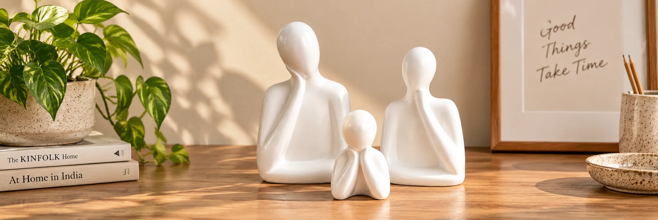 White ceramic family sculpture set by ArtyCera styled for desk and home decor in India