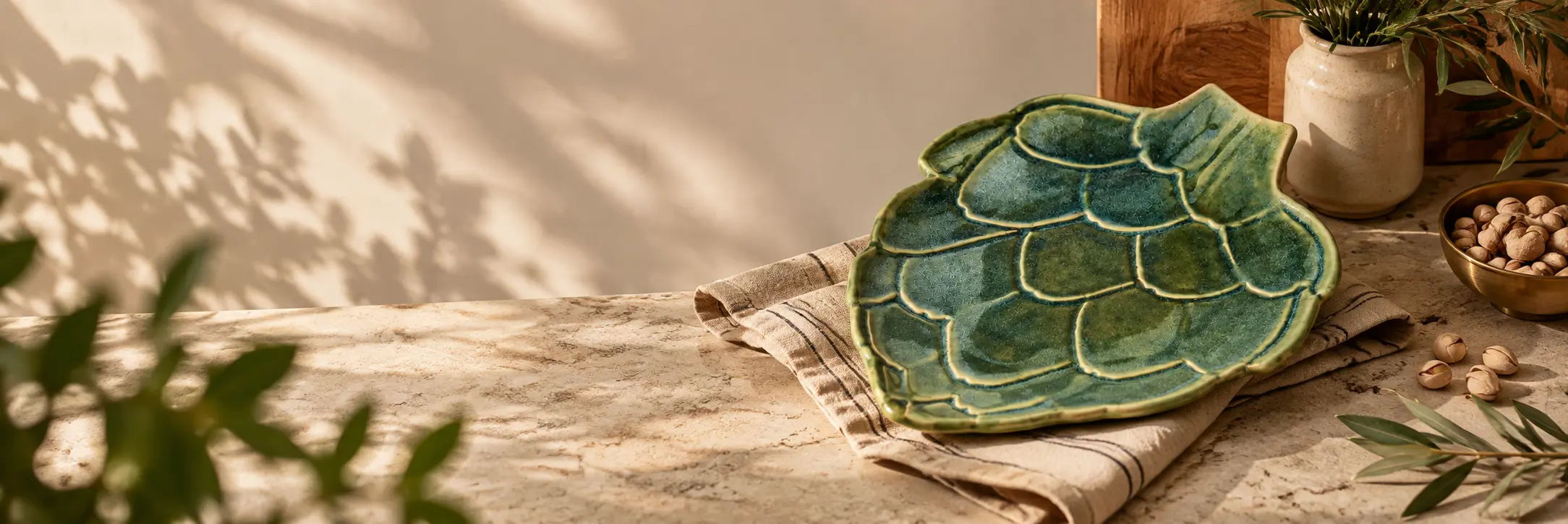 Handmade green artichoke ceramic serving platter by ArtyCera styled for serving in India
