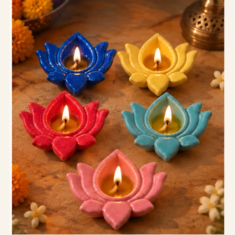 Ceramic lotus diyas burning with oil and cotton batti for traditional Diwali lighting